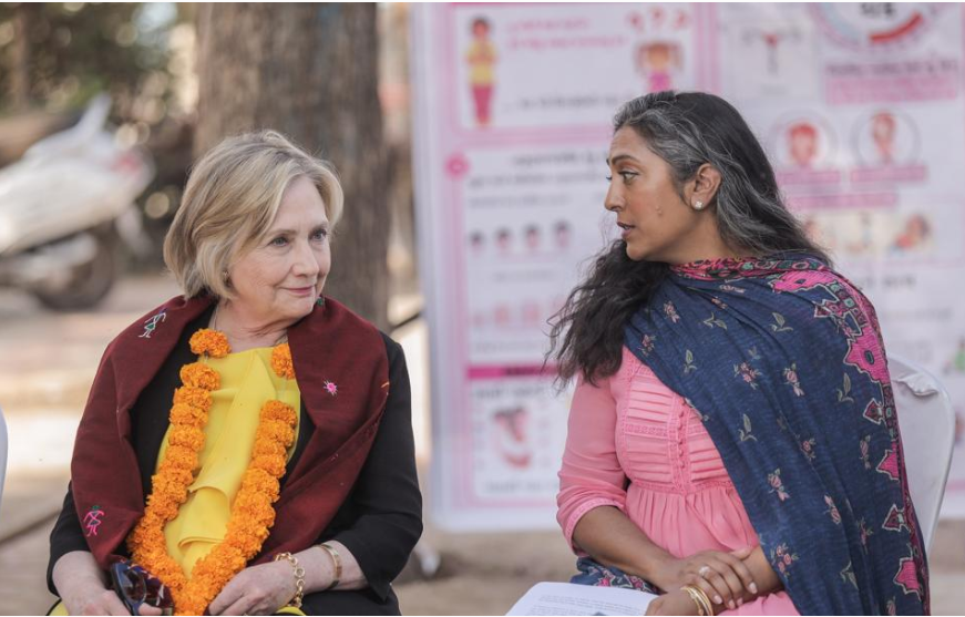 Hillary Clinton with President Megha Desai, visiting work in the field in 2023
