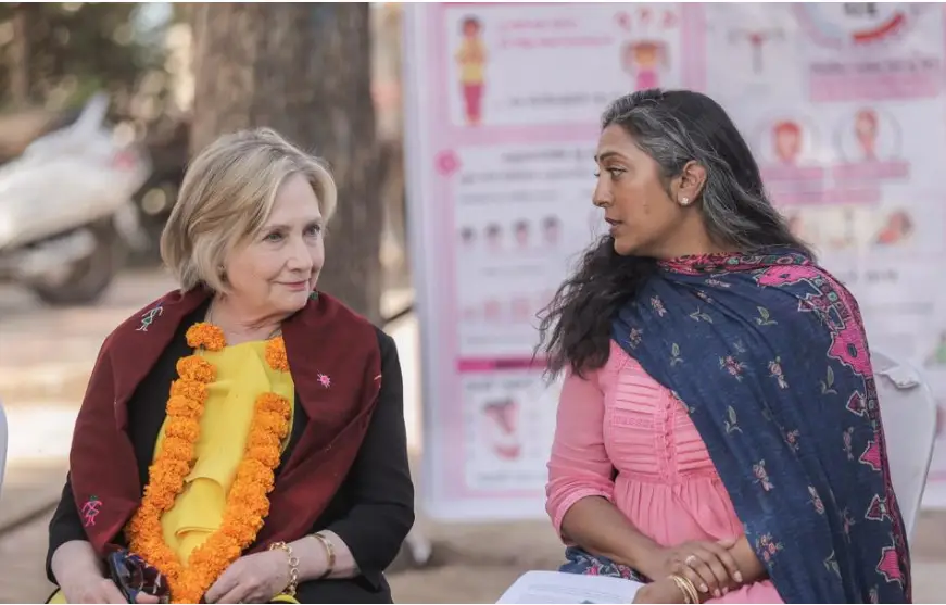 Hillary Clinton with President Megha Desai, visiting work in the field in 2023